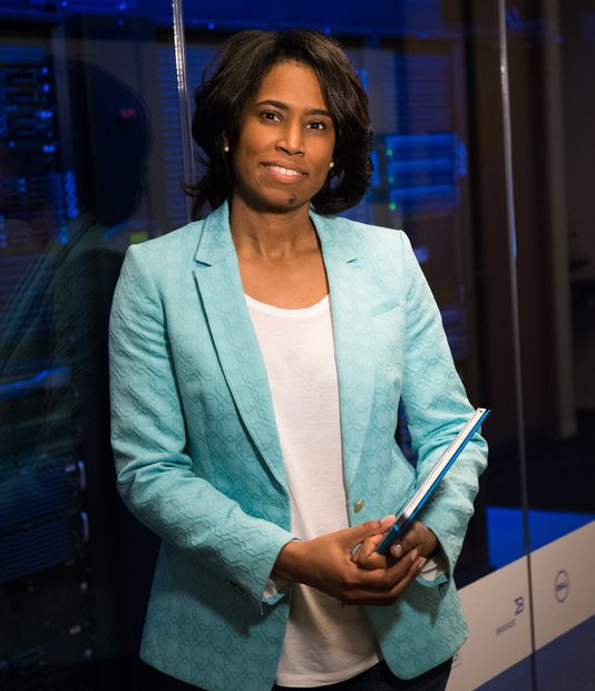 Canva - Woman in Teal Blazer Coat and Black Pants Holding A Tablet